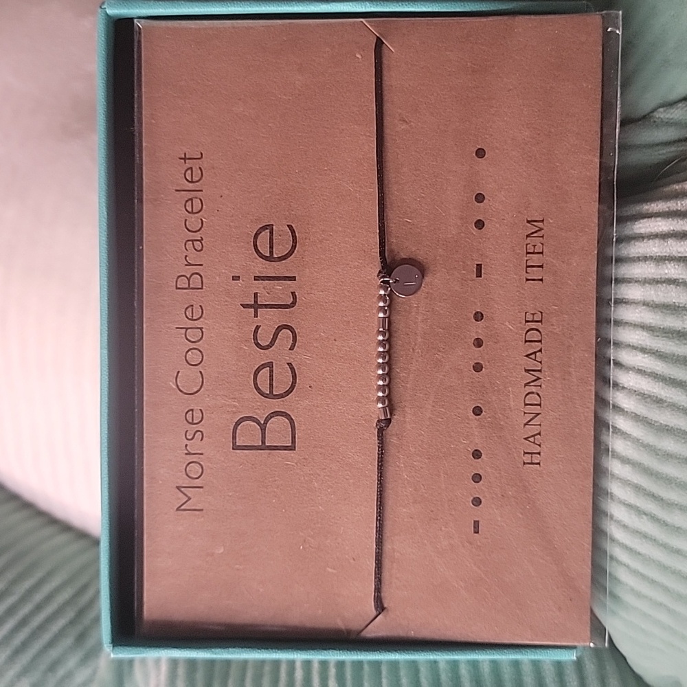 Bestie Morse code bracelet with the letter L attached on a charm